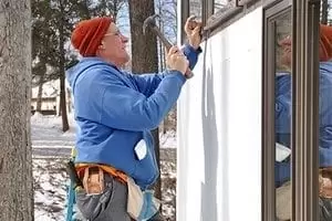 Man installing windows Man installing windows